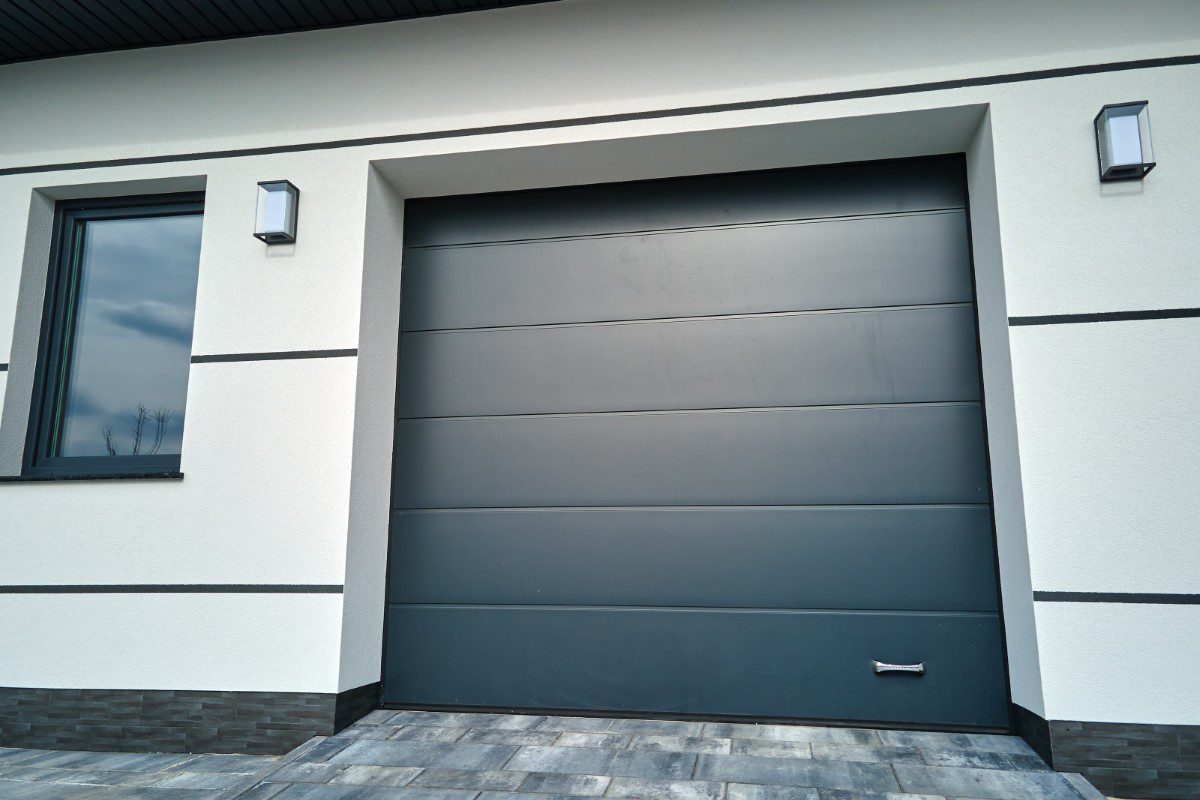 Modern garage door with adjacent window.